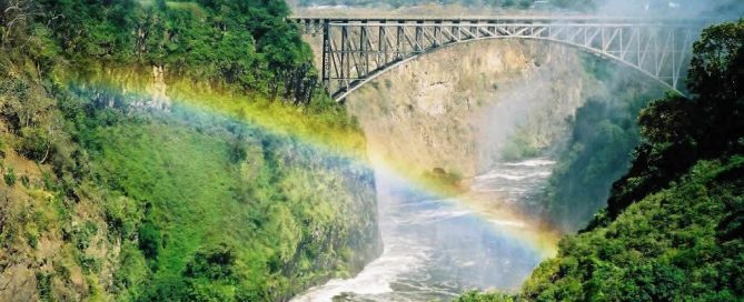 Victoria Falls rainbow over the Zambezi River between Zambia and Zimbabwe